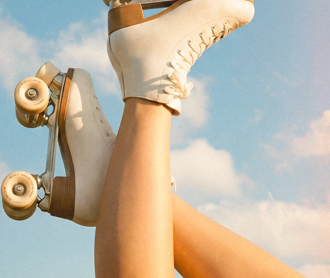 AI product image: roller skates and a perfume bottle against the sky