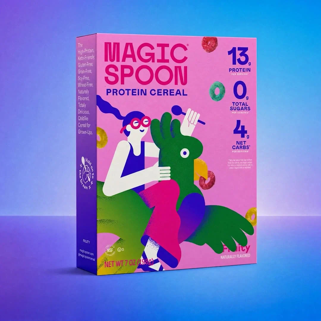 Pink Magic Spoon cereal packaging against a blue and purple background
