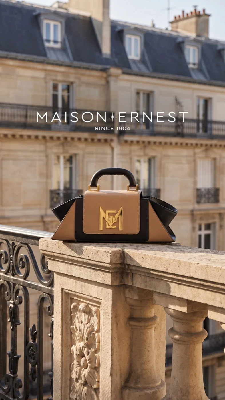 Maison Ernest handbag displayed on a Parisian balcony.