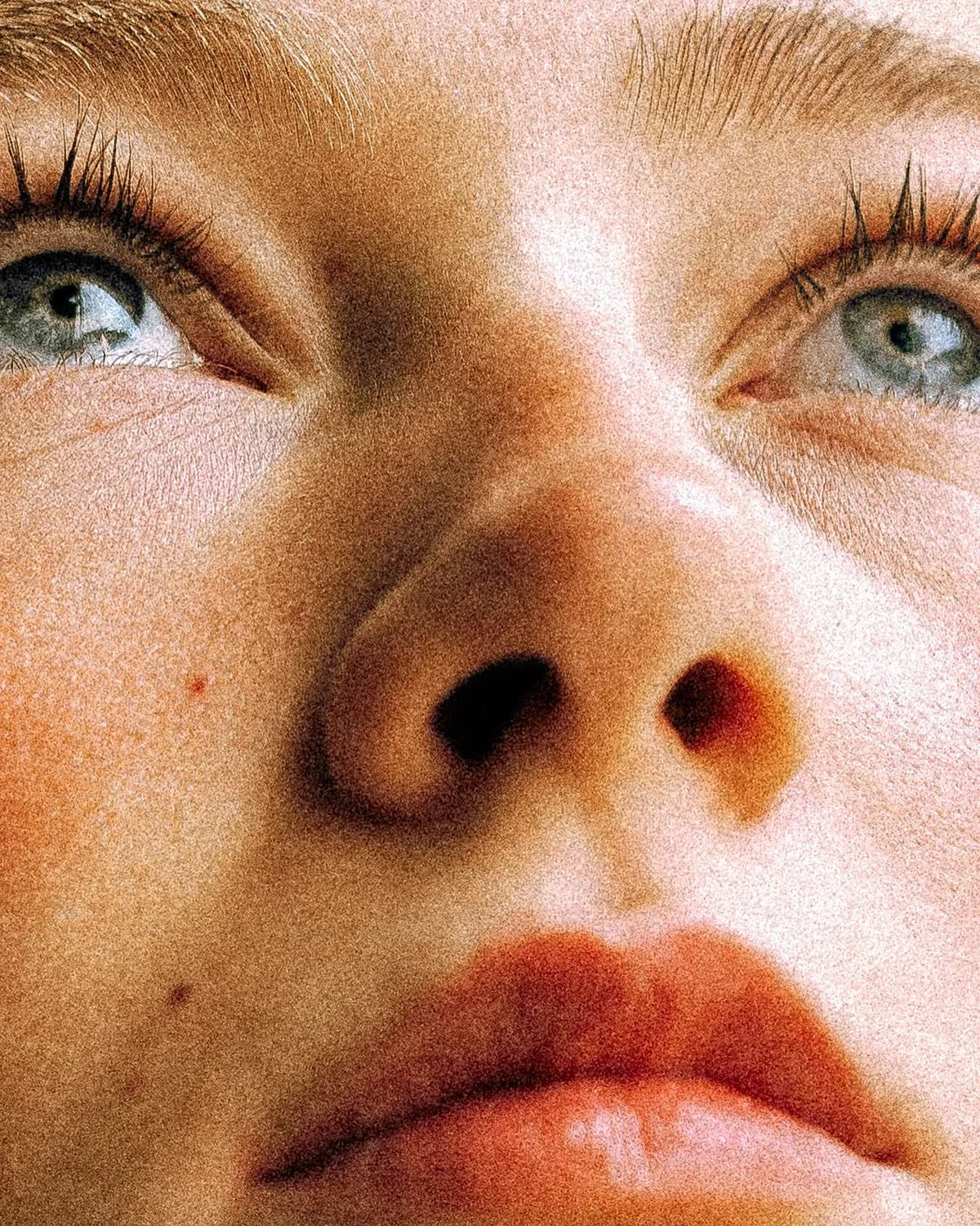 Grainy close-up portrait from the Marketer.com brand world