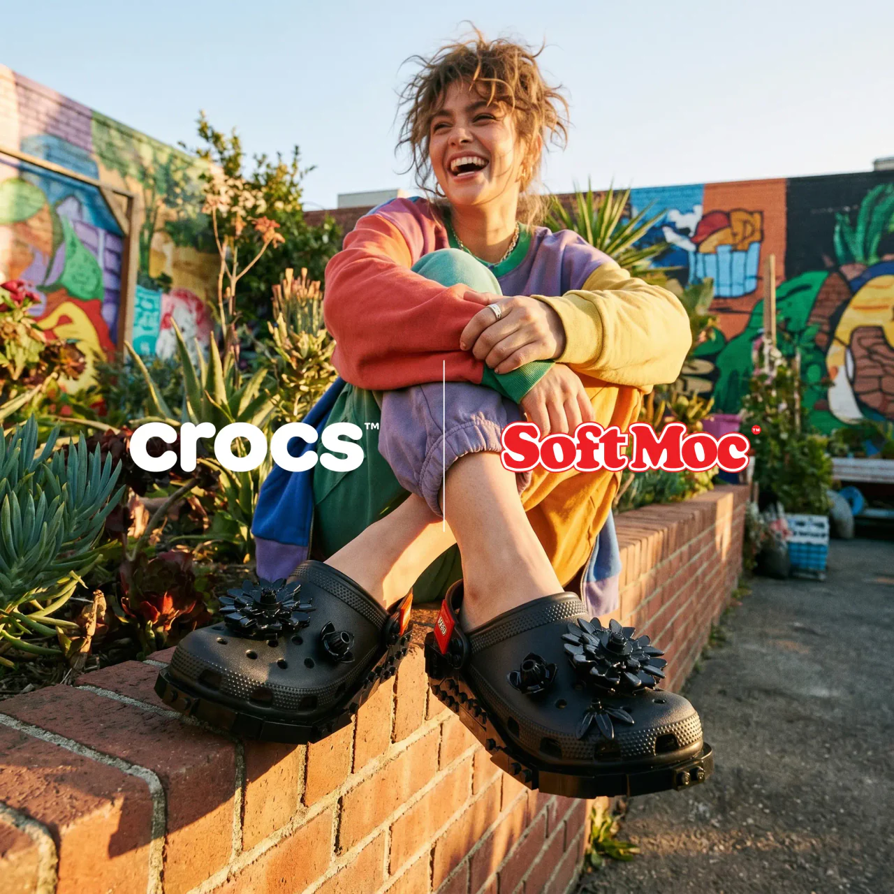 SoftMoc lifestyle creative featuring black Crocs